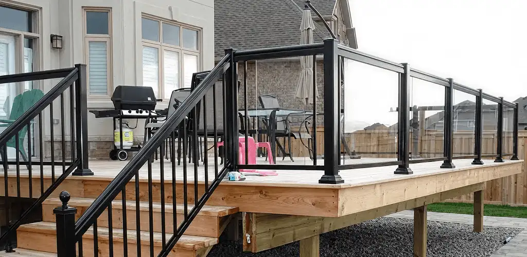 Handrail installation on a deck staircase for safety and code compliance in Akron, OH