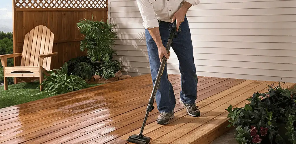 Deck staining service applying stain to a backyard wood deck in Akron, OH
